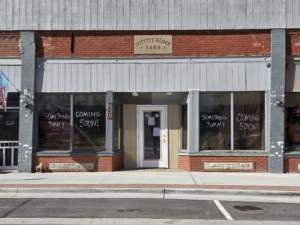A storefront on Nelson Street in Edgerton with the words written Something Yummy Coming Soon