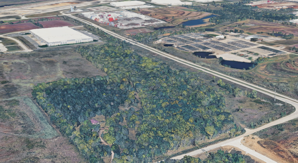 A treed lot at the corner of 199th and Homestead Lane in Edgerton